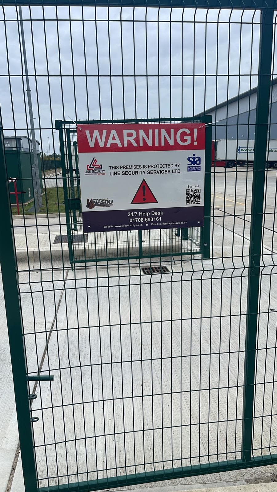 SIA licensed security officer patrolling a commercial construction site